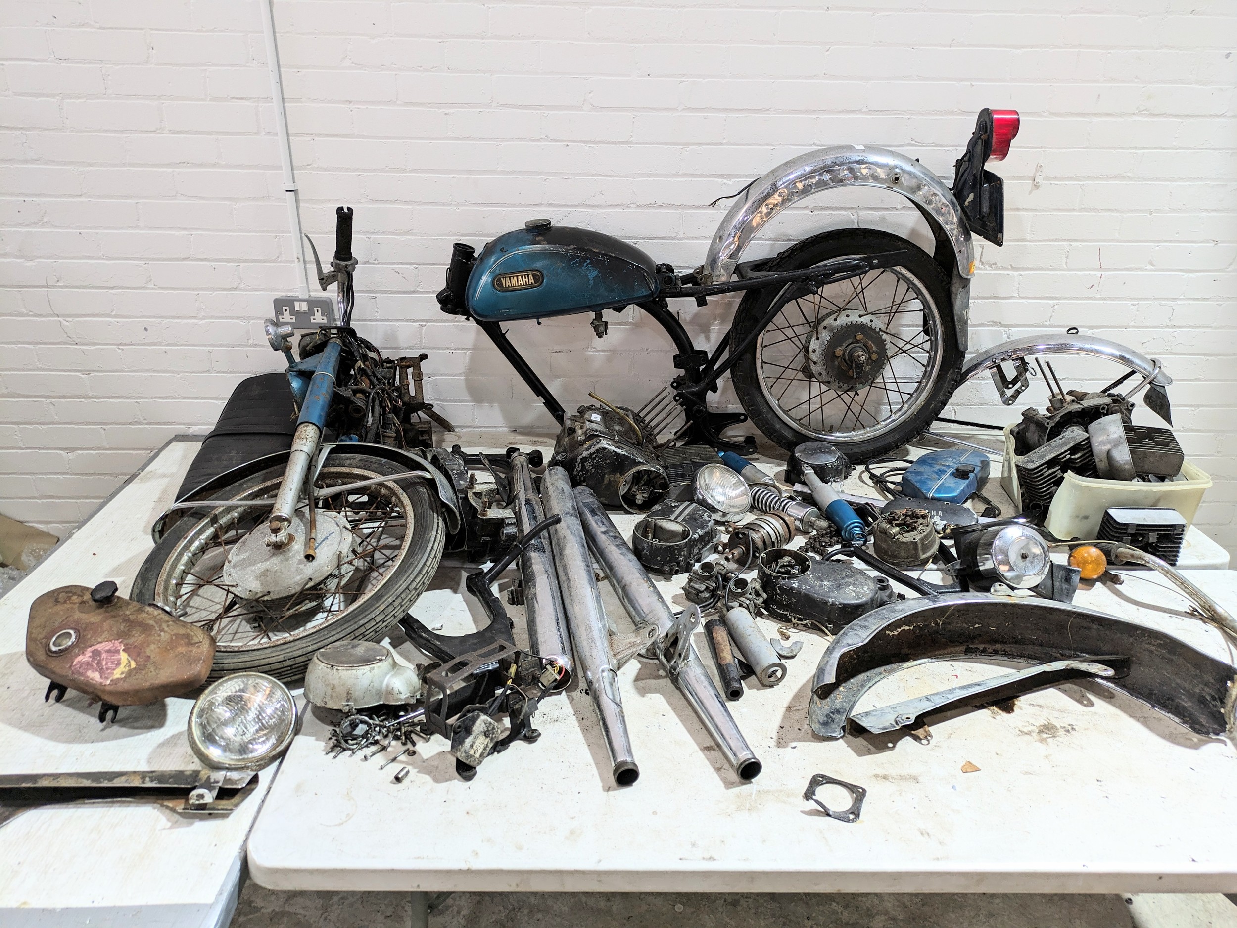 A 1973 Yamaha 200 Electric 2 stroke with parts and documents