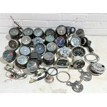 A quantity of various vintage motorbike clocks