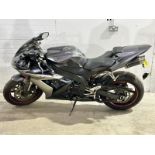 A 2004 Yamaha R1 Raven Edition, with key. Needs battery.