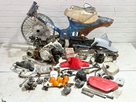 A Honda 90 cub frame with parts