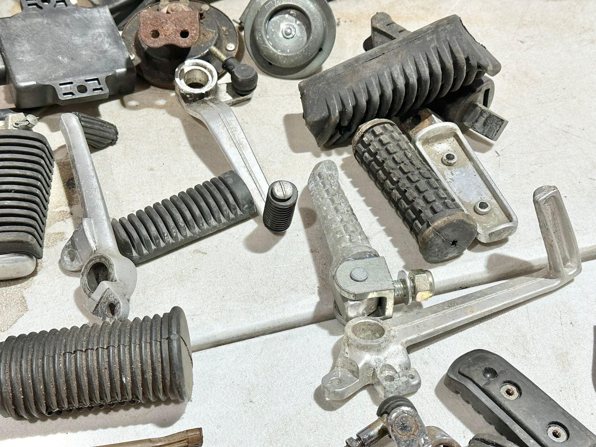 A sundry lot of various motorbike electrical parts with foot rests etc - Image 12 of 14
