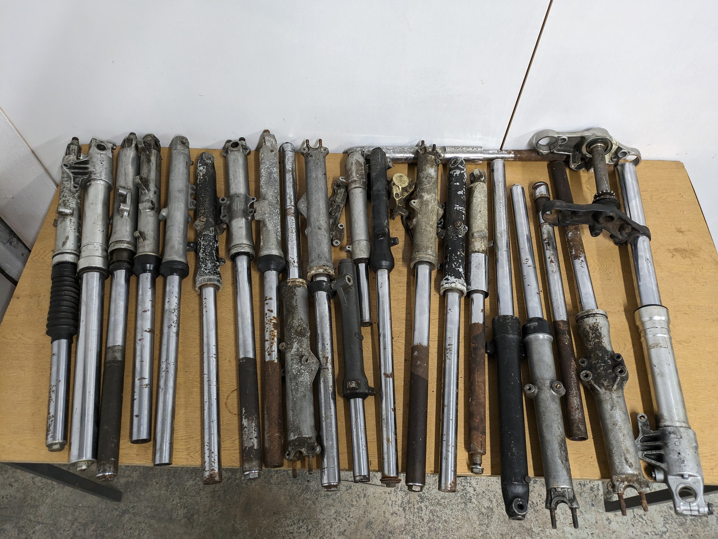 A quantity of assorted motorbike forks