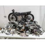 A 1979 Honda CB350-4 frame with parts and documents