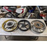 3 motorbike wheels, Kawasaki and Aprilia