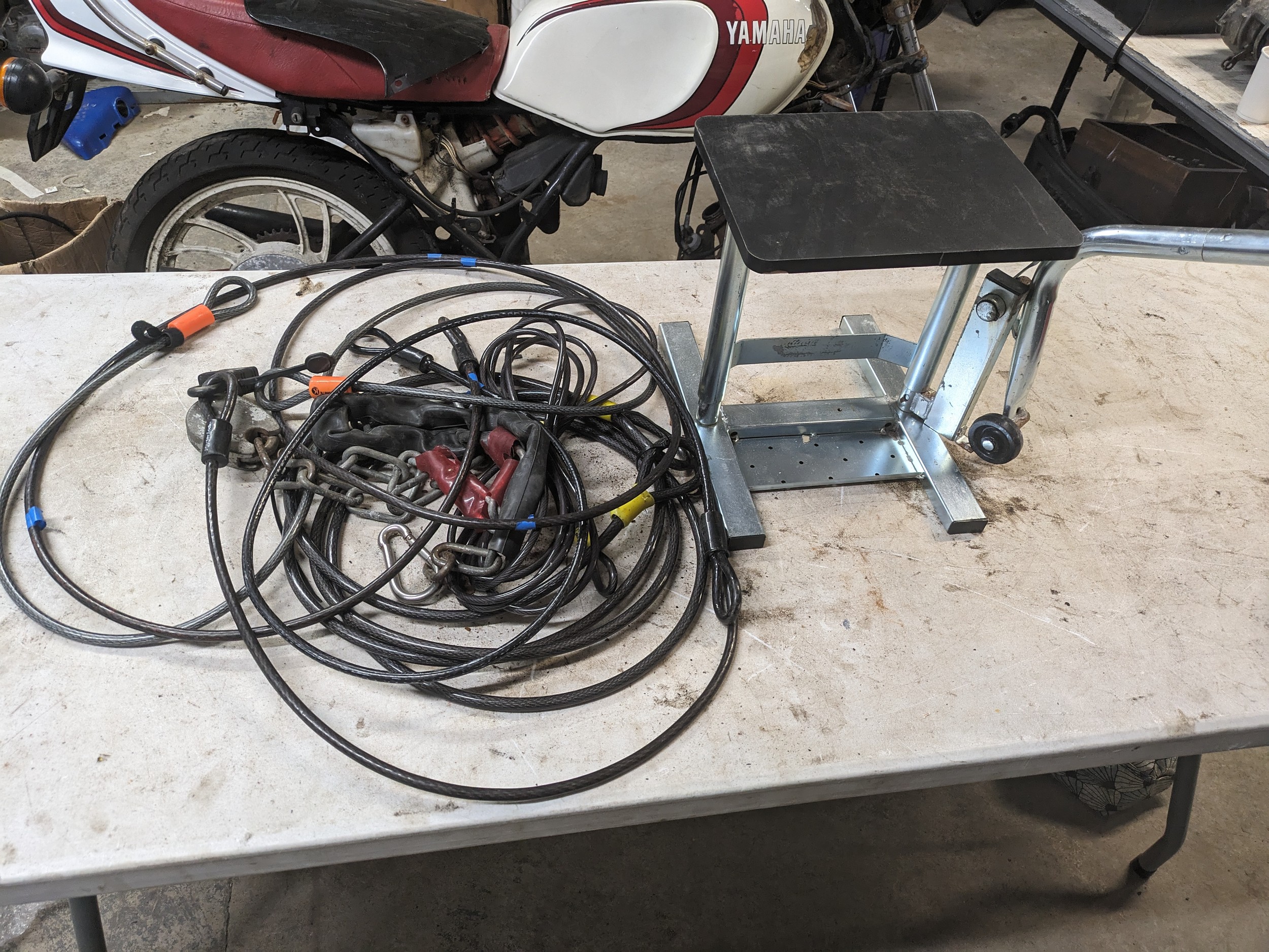 Motorbike stand with cables