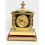 A late 19th century French brass mantle clock on stand. L. Marti Medaille D’Argent 1889. With key