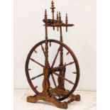 An Early 20th Century spinning wheel. 62x108cm