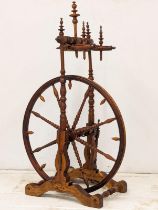 An Early 20th Century spinning wheel. 62x108cm