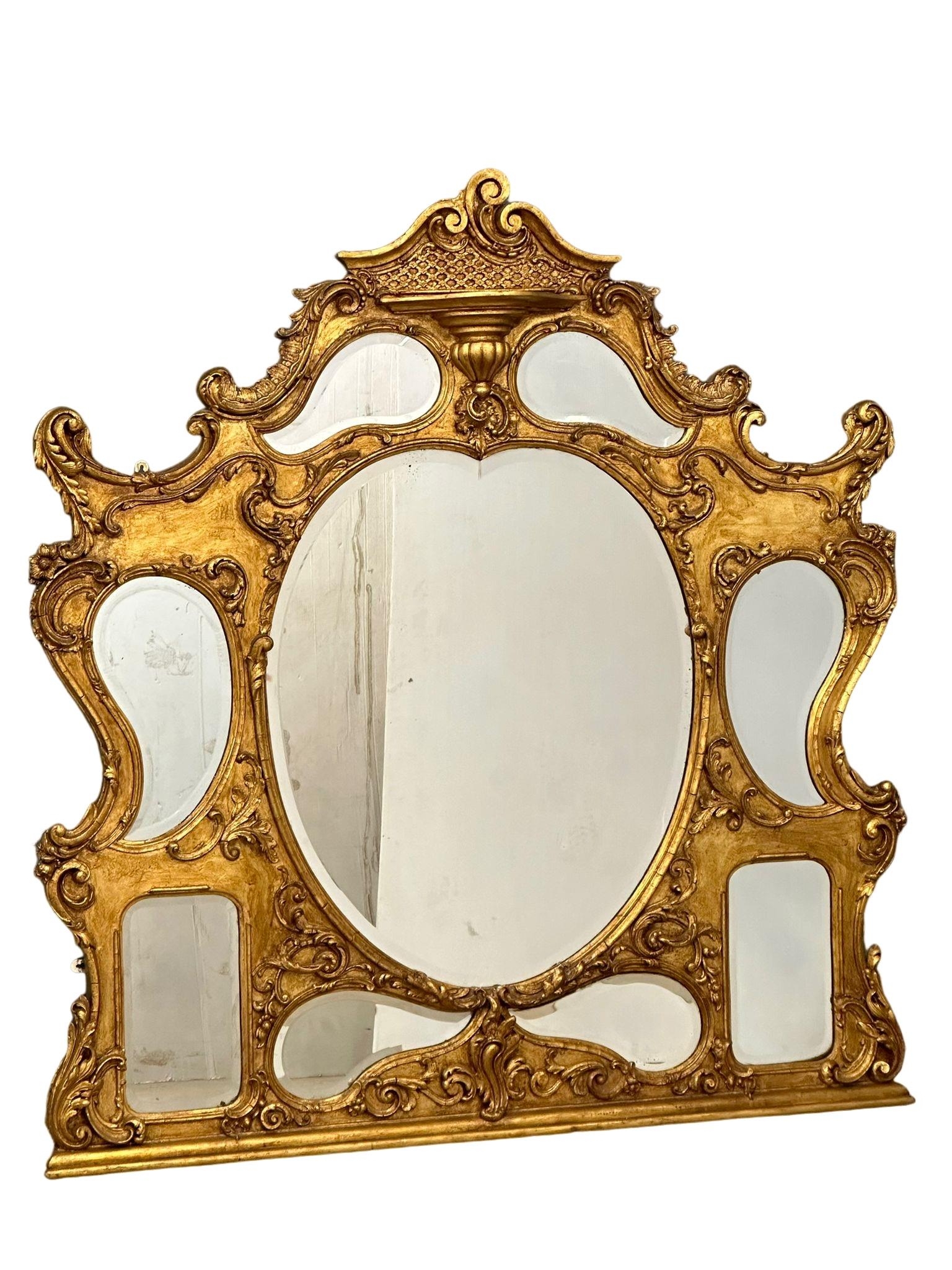 A large Early/Mid 19th Century Rococo gilt framed over-mantle mirror. 140x147cm