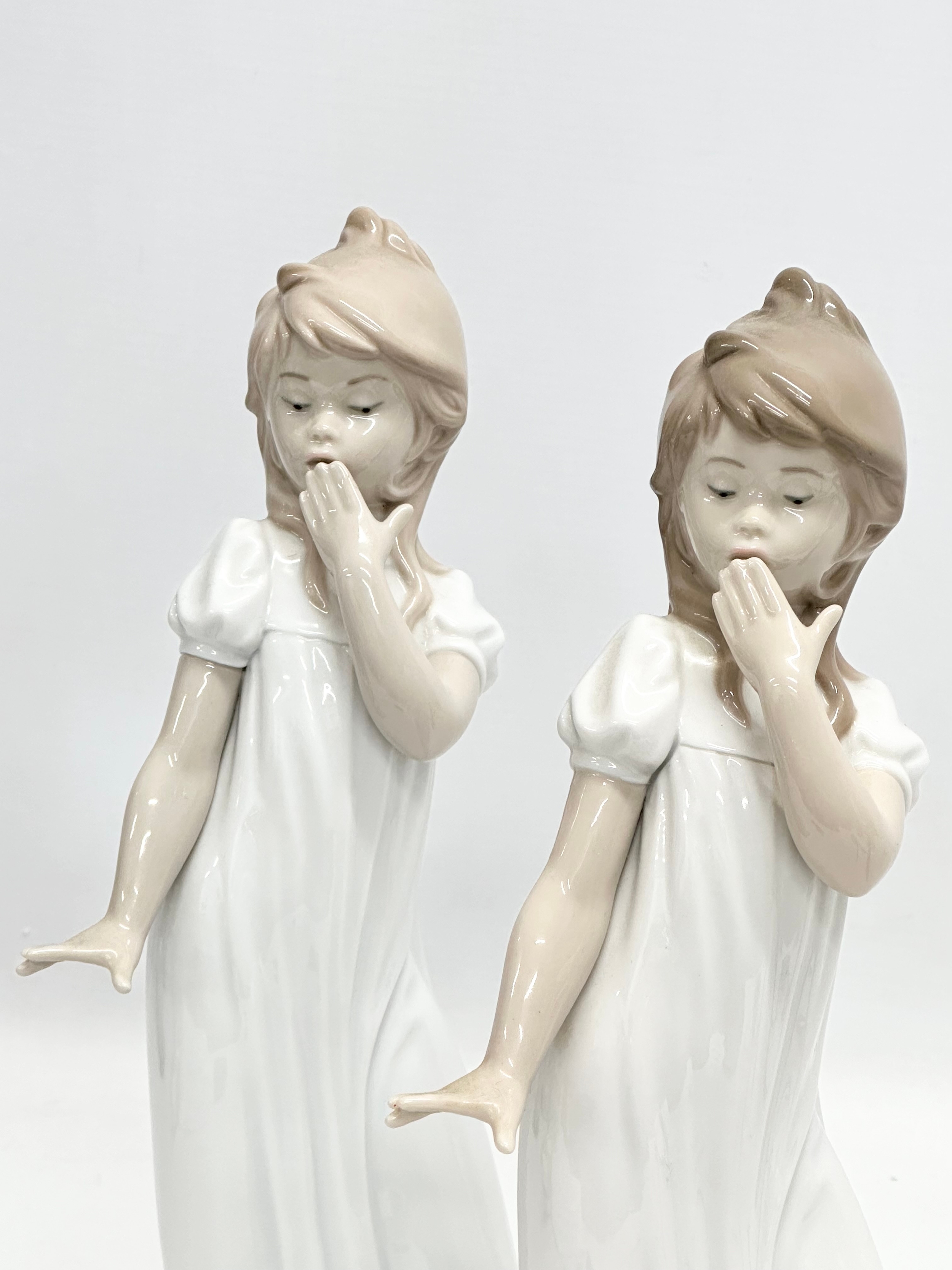 A pair of large NAO ‘Yawning Girl’ figurines. 29.5cm - Image 2 of 2