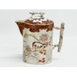 A 19th Century Japanese hand painted chocolate pot/teapot. With bamboo design handle and embossed
