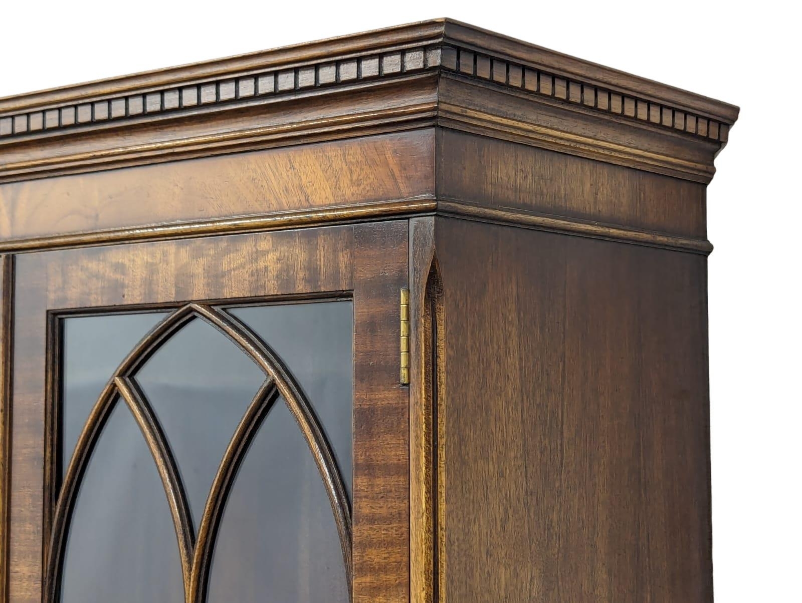 A Georgian style mahogany bookcase with brushing slide and astragal glazed doors. 75x40x176.5cm - Image 4 of 6