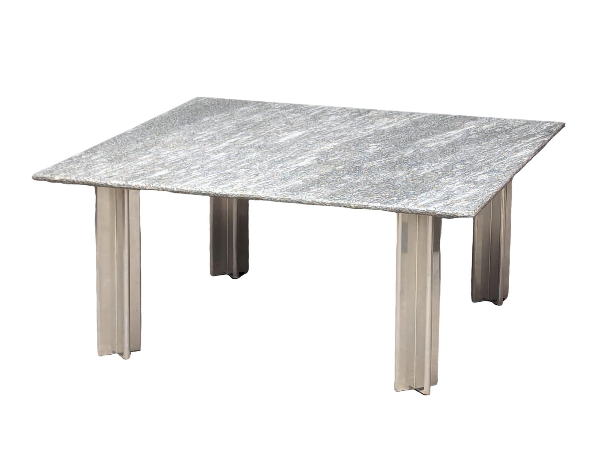 A Zanotta granite top coffee table on alloy supports, 90cm x 90cm x 41cm