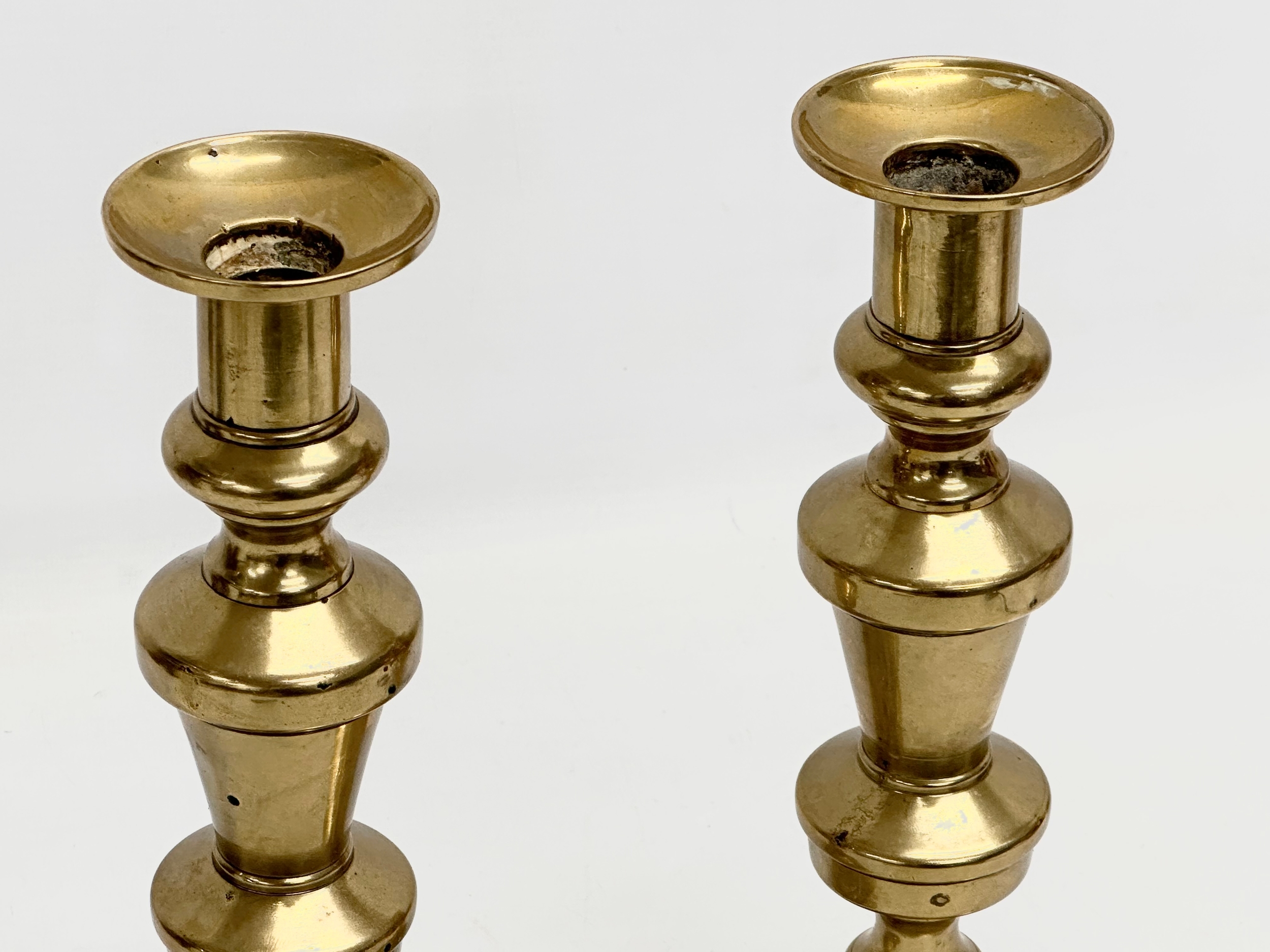 A pair of large Victorian brass candlesticks. 27cm - Image 2 of 3