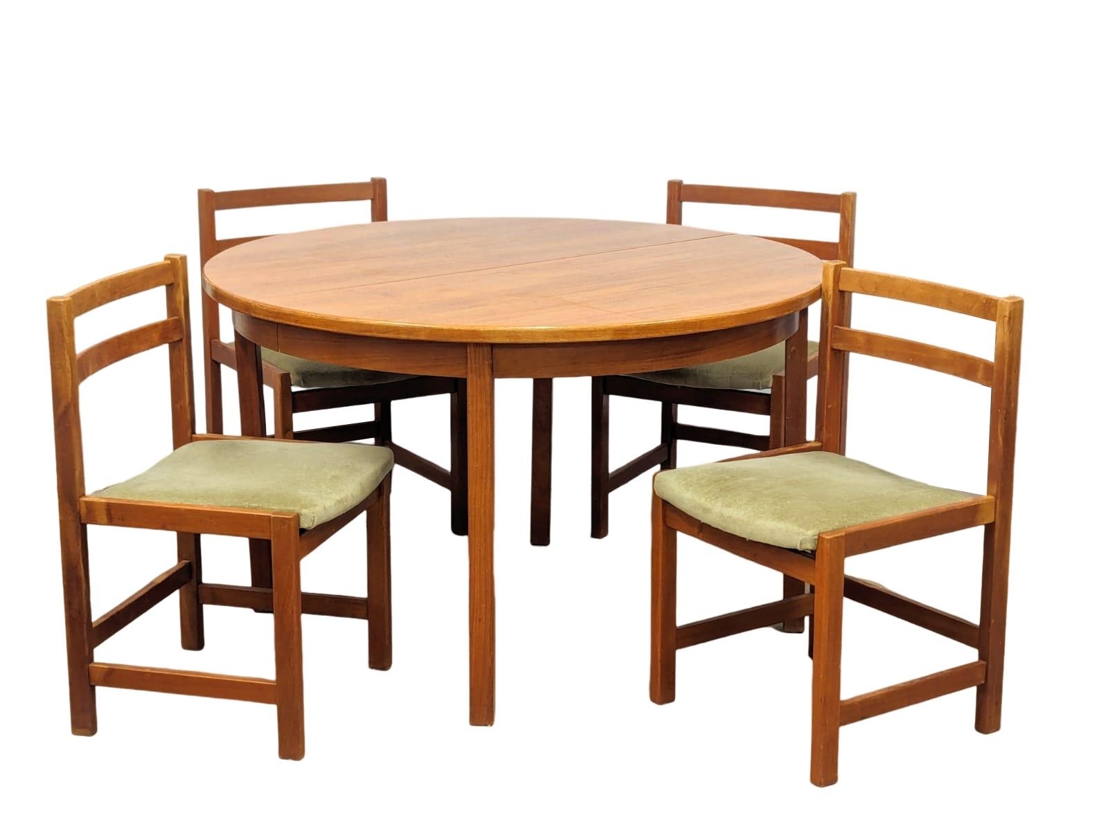 A Mid Century teak dining table with a set of 4 Mid Century dining chairs. 120x73cm