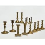 5 sets of Victorian brass candlesticks. 3 pairs and 2 sets of 4. 12cm, 11cm, 11.5. 6cm