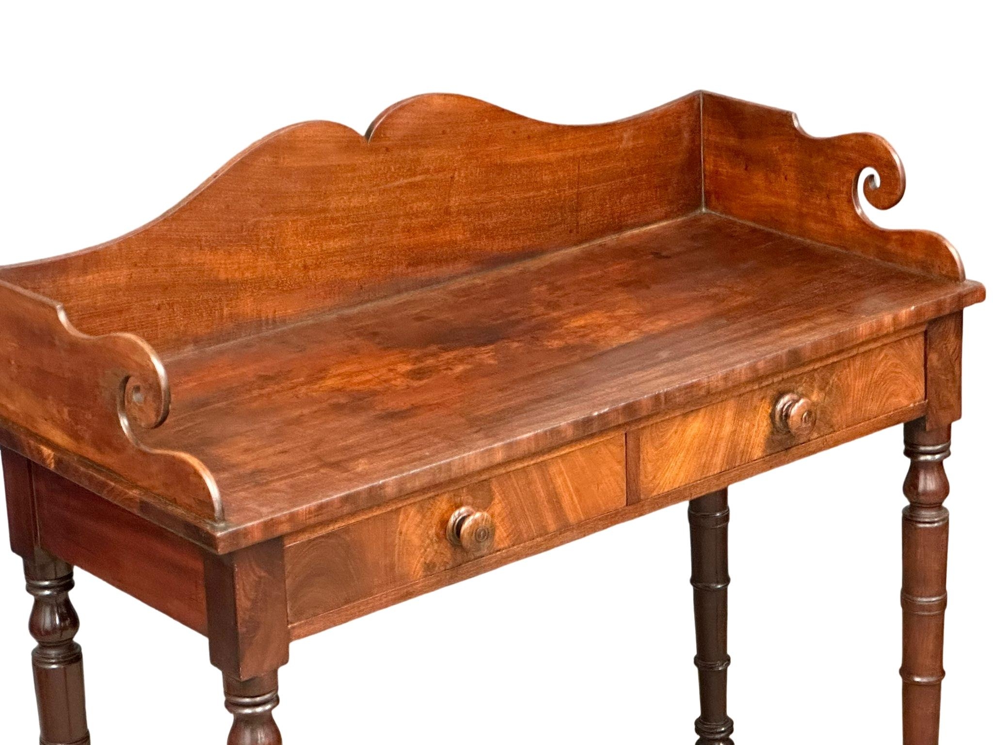 A late George IV mahogany gallery back side table on reeded legs, containing 2 front facing drawers. - Image 9 of 10