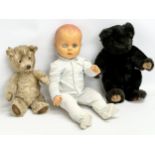 A vintage doll and teddy bears. 1 by Hamleys.