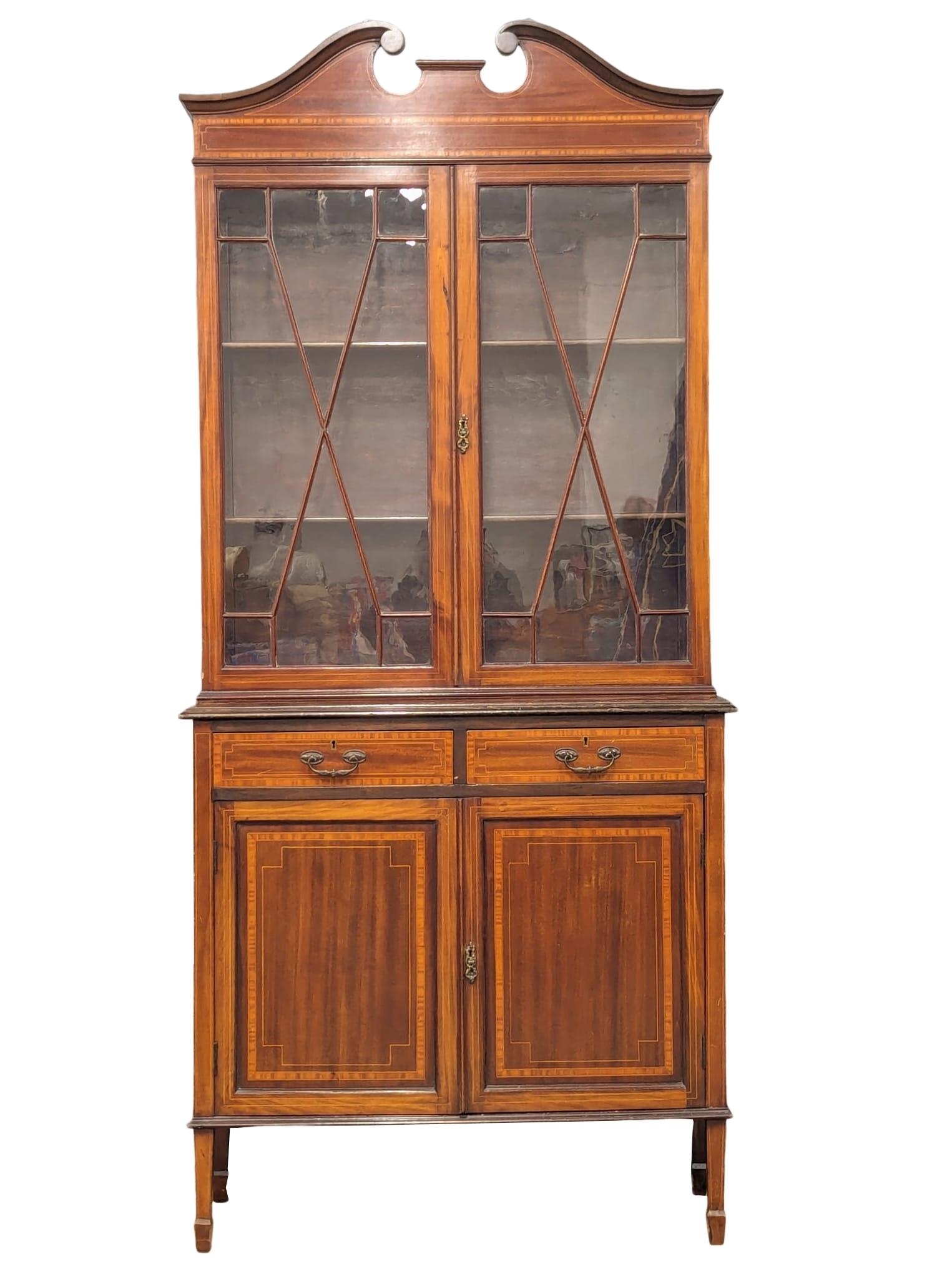 An Early 20th Century Sheraton Revival inlaid mahogany bookcase. Circa 1900. 91x41x200cm