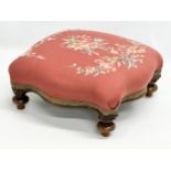 A Victorian tapestry top footstool. 38x37x17cm