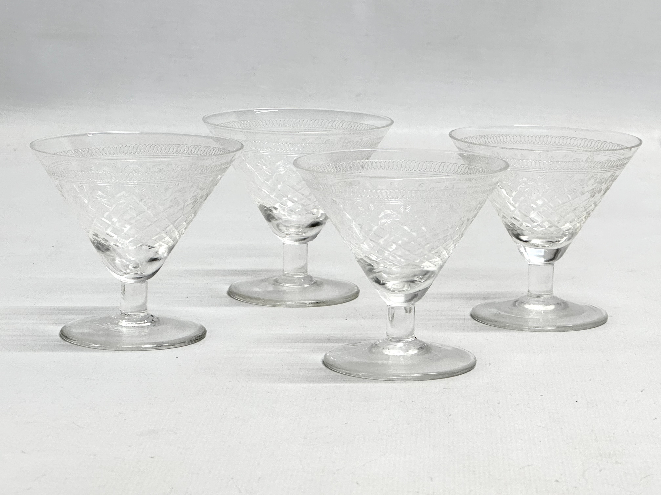 A set of 4 Edwardian low stem etched liquor glasses. 7x6.5cm