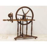 An Early 20th Century spinning wheel. 76x78cm