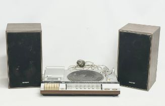 A Sharp SG-280E Stereo Music Center with speakers.
