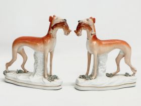 A pair of Late 19th Century Staffordshire whippets. 18x19cm