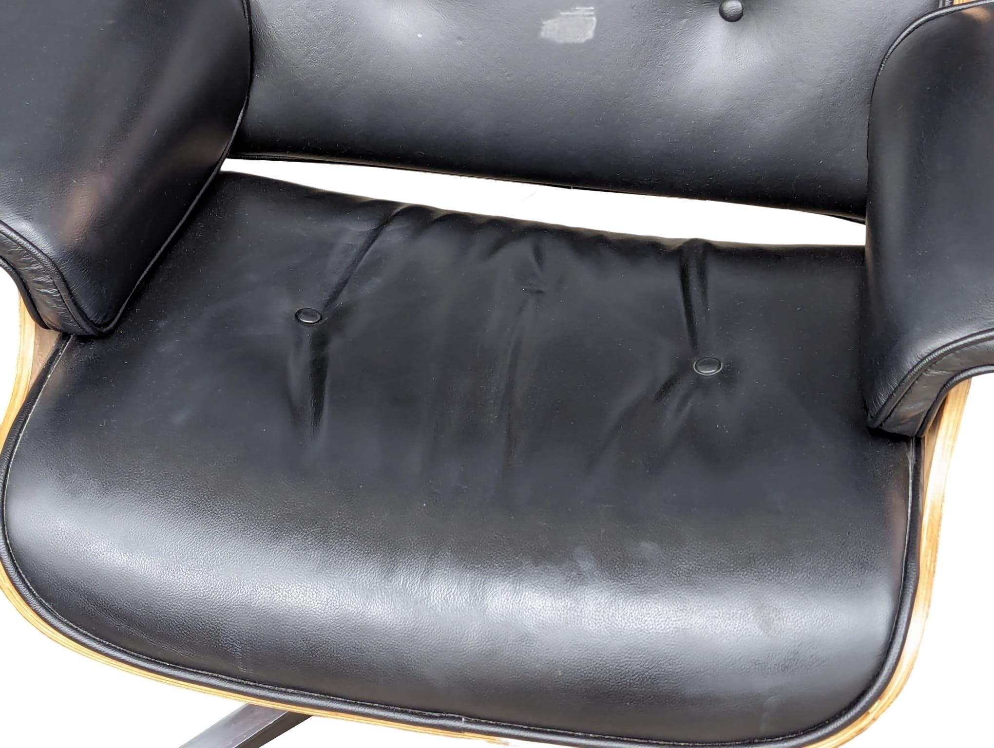 A Charles & Ray Eames Style swivel chair and ottoman. - Image 7 of 8