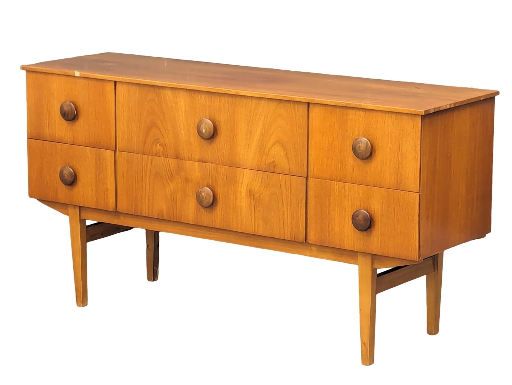 A mid century teak sideboard, 133cm x 39.5cm x 69cm