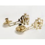 A pair of Early 20th Century brass harp design wall mounted candleholders. 22cm