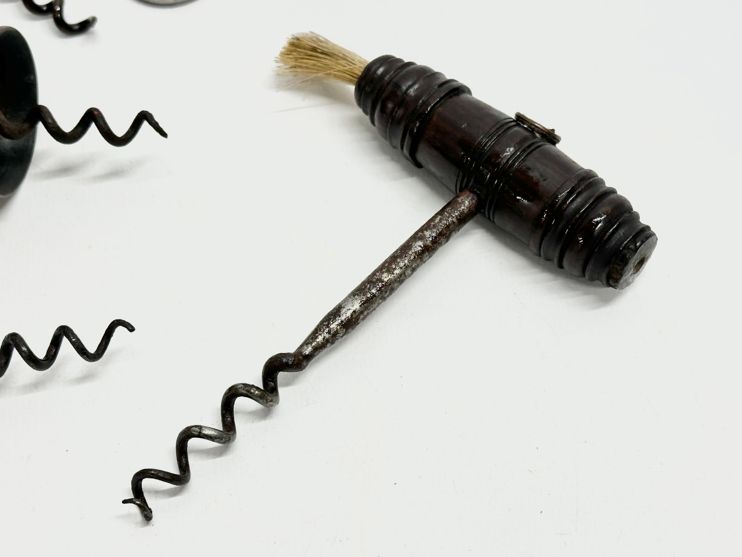 A good collection of 19th Century corkscrews with turned handles. A large barrel shaped corkscrew - Image 6 of 9