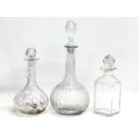 3 Mid 19th and Early 20th Century glass decanters. A large Mid 19th Century decanter 35cm.
