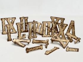 A collection of vintage cast iron Roman Numerals