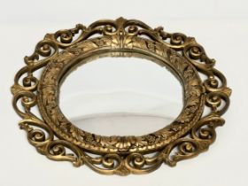 A vintage Aisonia gilt framed convex mirror. 58cm