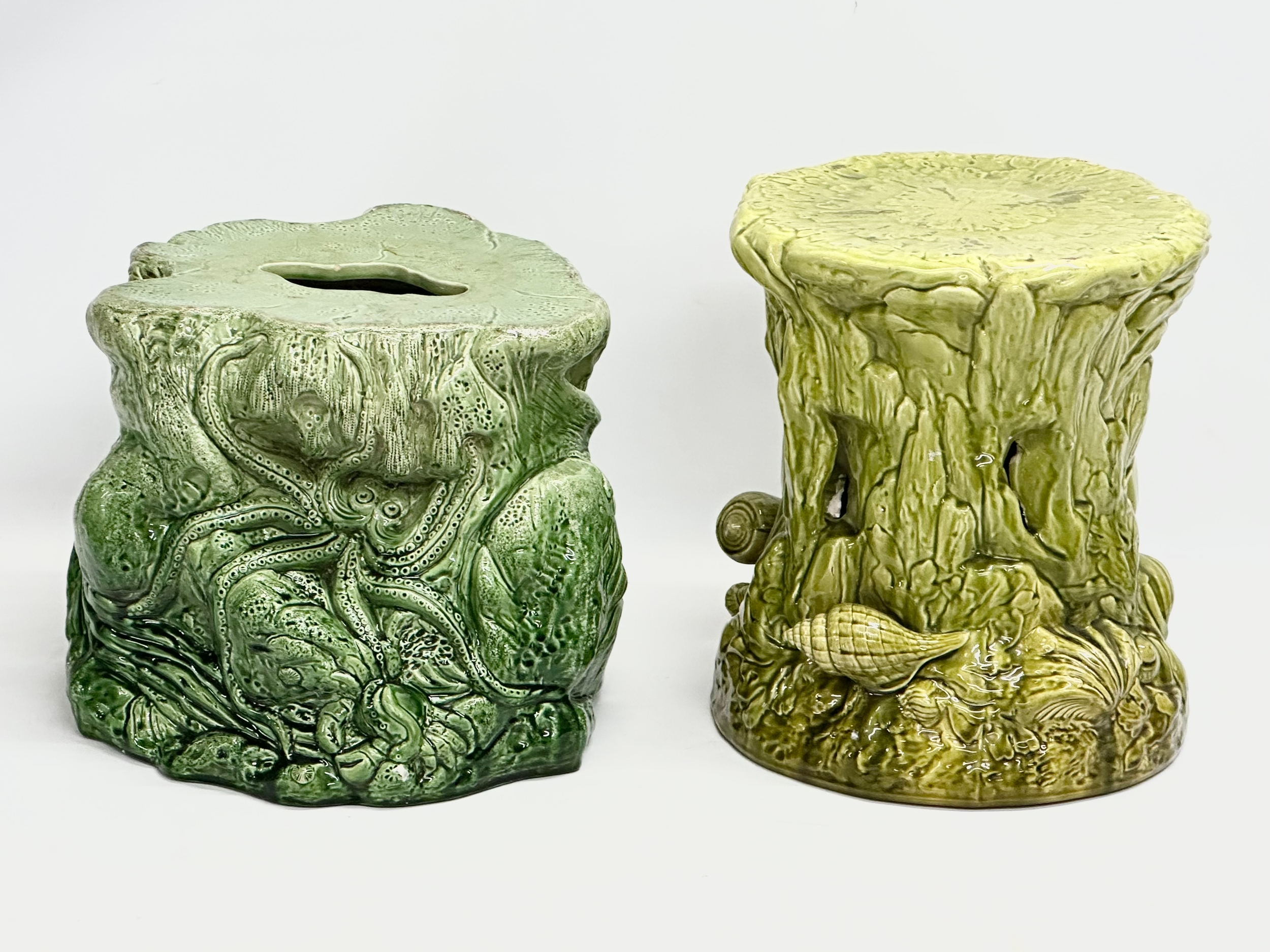 2 Late 19th Century Majolica garden seats/jardiniere stands. 1 (Bretby) damaged. 35x29cm. 31x34cm