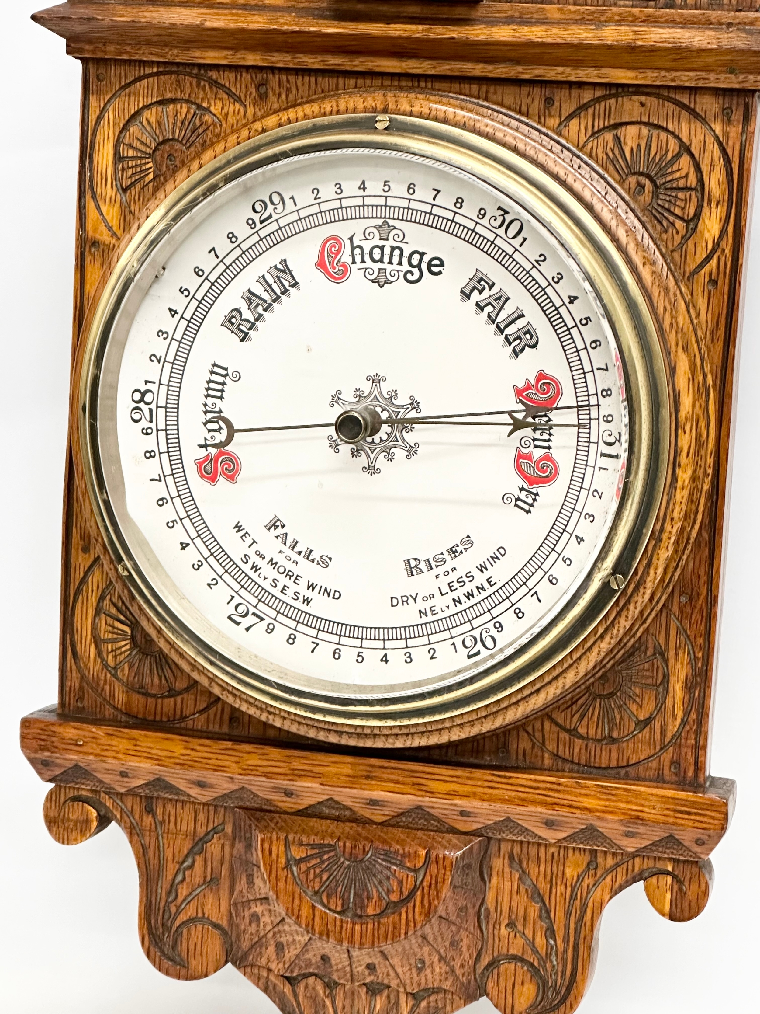 A Victorian carved oak barometer. 28x84cm W - Image 3 of 5