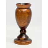 A 19th Century turned wooden Lignum Vitae vase. 18.5cm