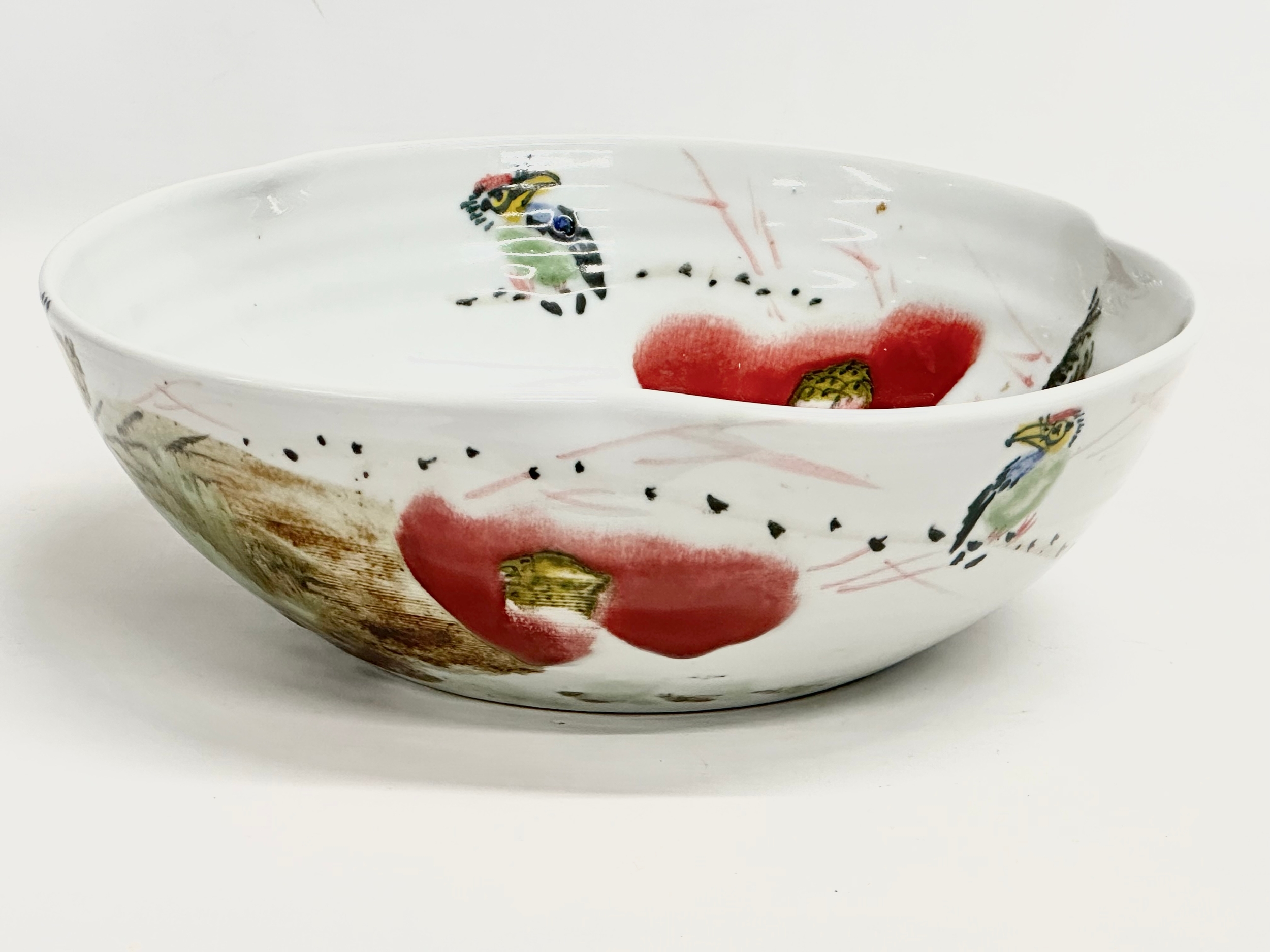 A large glazed porcelain curved rim bowl designed by John Richard. 32x32x11cm