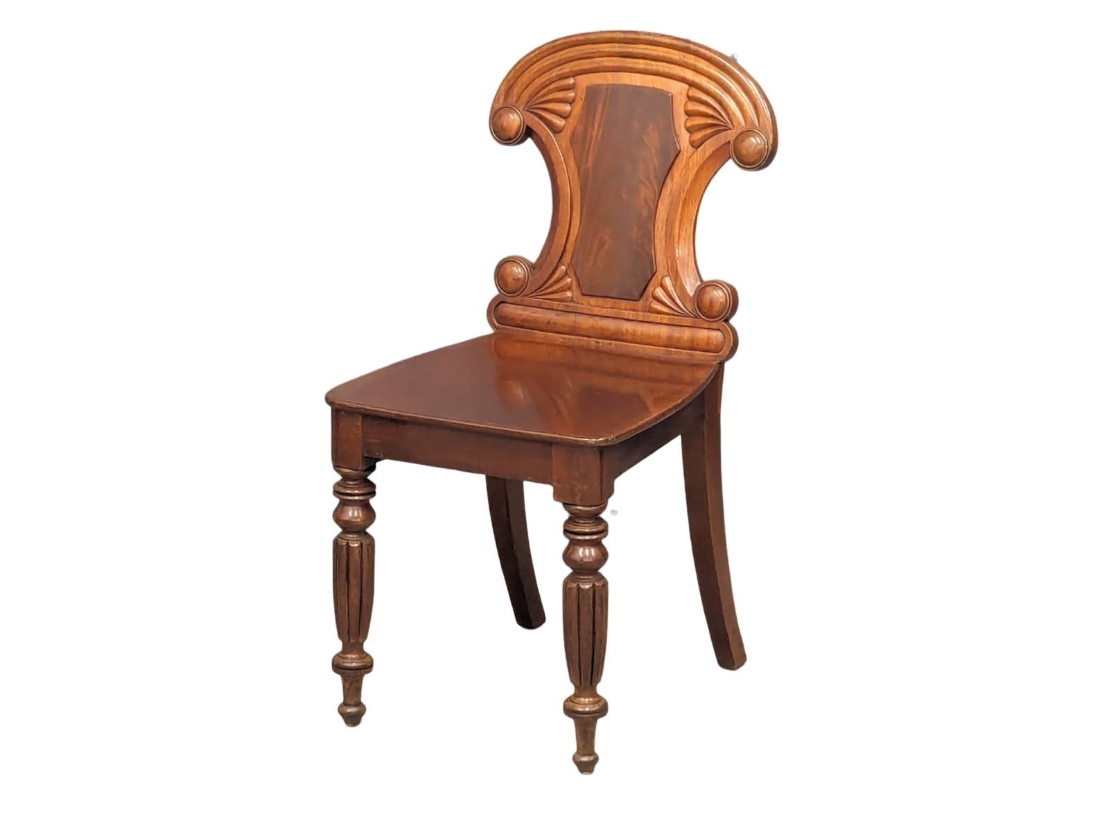 A pair of late George IV-Early William IV ornate mahogany hall chairs - Image 4 of 6