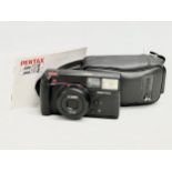 A Pentax 70-S Zoom camera with case.