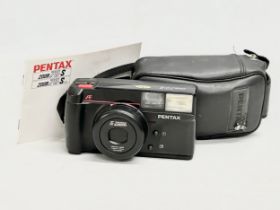 A Pentax 70-S Zoom camera with case.