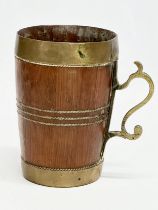 A Late 19th Century Victorian brass bound Yew wood tankard. 12x8.5x13cm