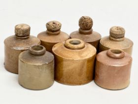 A collection of 19th Century stoneware ink bottles. 7cm