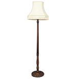 A mahogany standard lamp with reeded column. 197cm