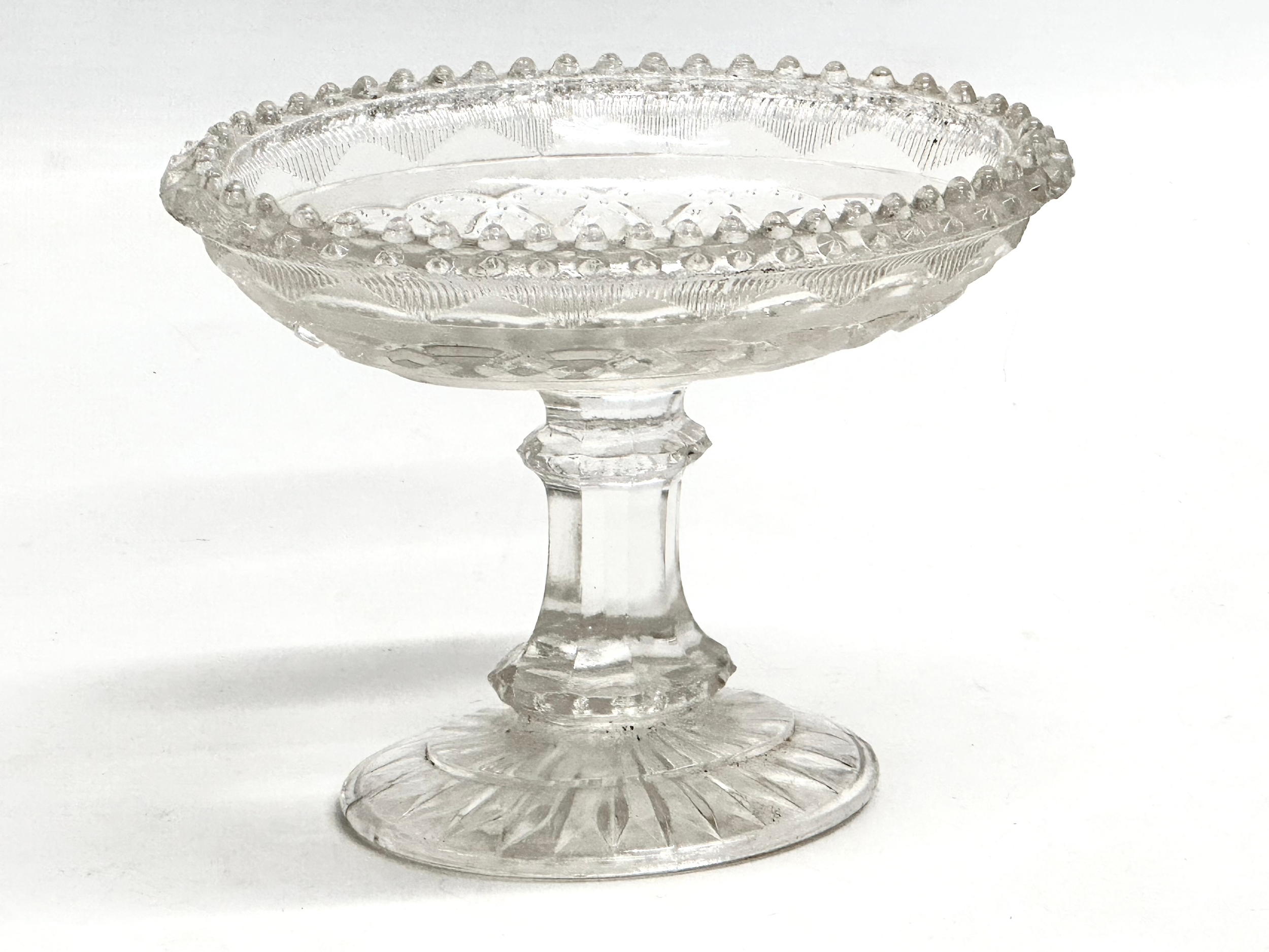 A 19th Century Victorian ‘Lozenge’ pressed glass comport with lemon squeezer base. Circa 1860-