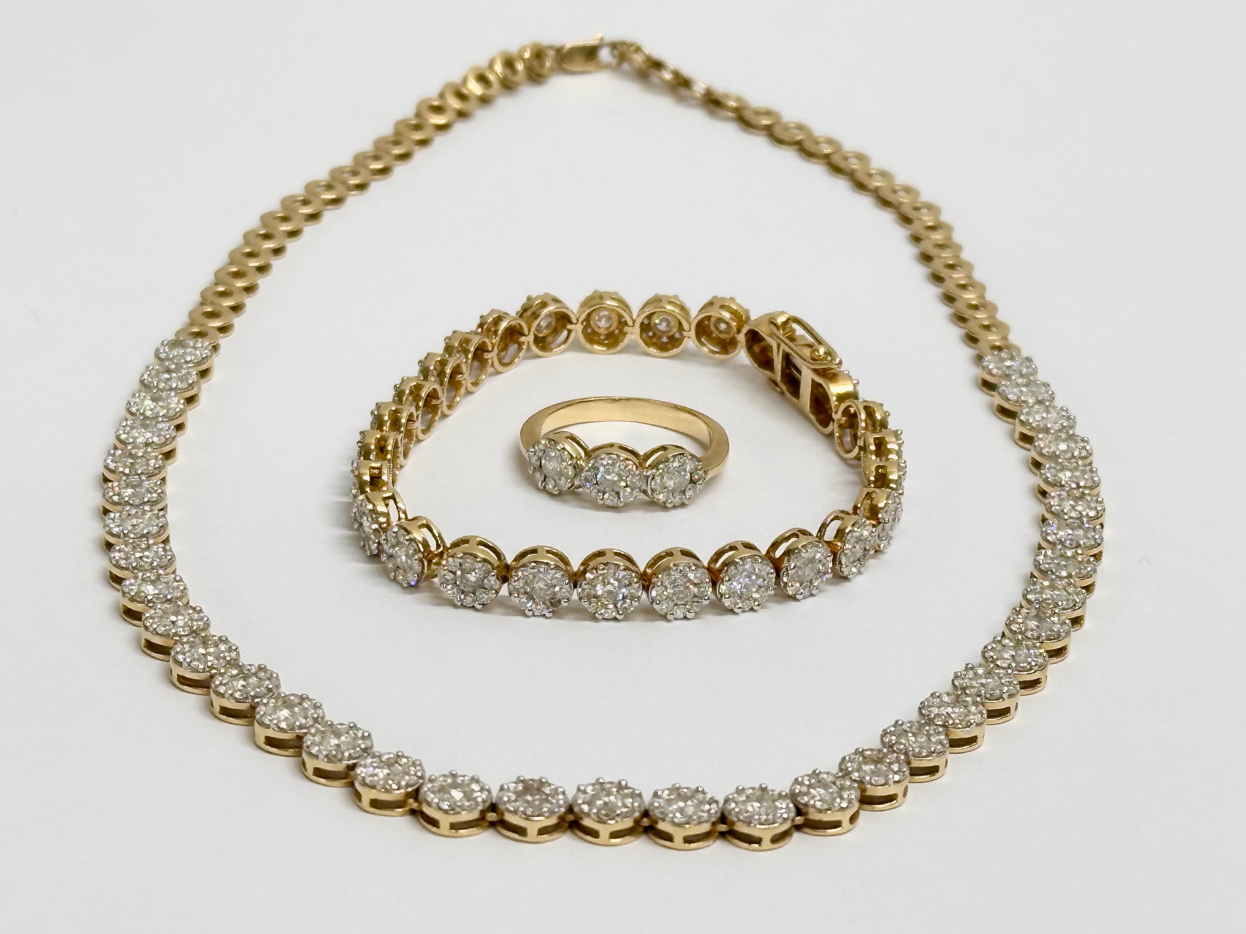 18ct gold and diamond set. 7ct Diamond necklace, 5ct diamond bracelet and matching ring. 48.3 grams