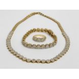 18ct gold and diamond set. 7ct Diamond necklace, 5ct diamond bracelet and matching ring. 48.3 grams