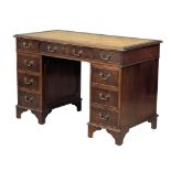 A George III style mahogany leather top desk, 118cm x 60cm x 77cm