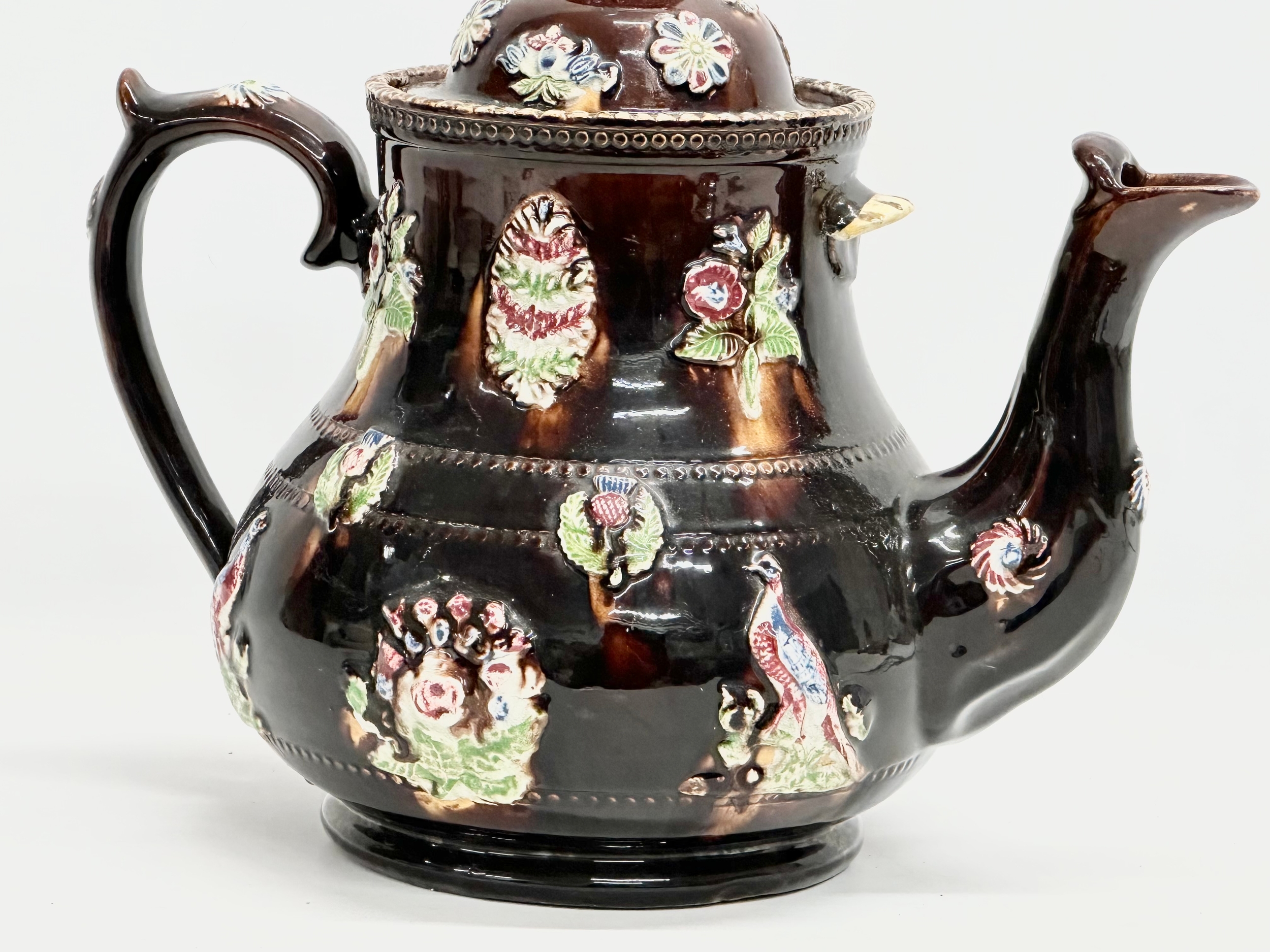 A large Late 19th Century Measham Pottery ‘Bargeware’ teapot. Circa 1880-1890. Forget Me Not. - Image 6 of 8